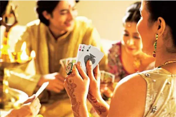 The joy of Diwali card games: Friends and family gather around the table for festive Teen Patti sessions filled with laughter and excitement