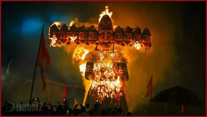 Night scene of Dussehra in North India with a huge Ravan effigy set on fire, symbolizing the victory of Rama over Ravan.